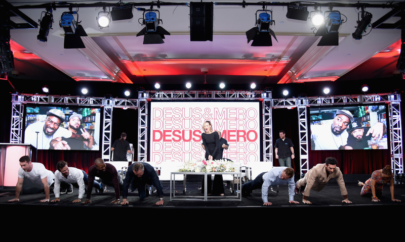 The cast of Six do push-ups onstage at TCA. (Photo: Michael Kovac/Getty Images for A+E Network)